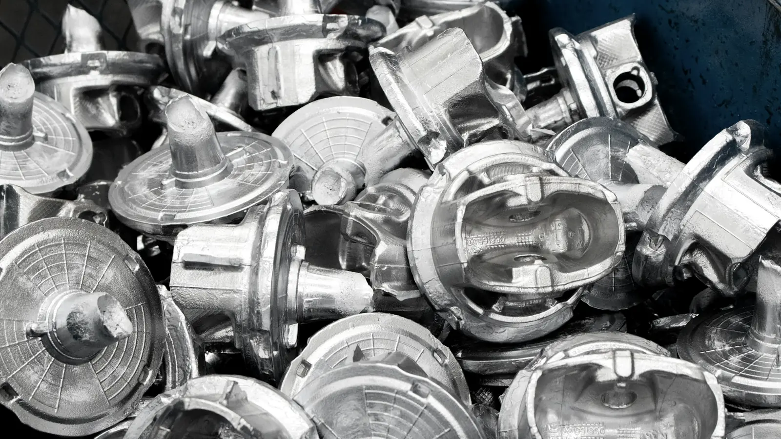 Clean aluminum castings sorted in a bin